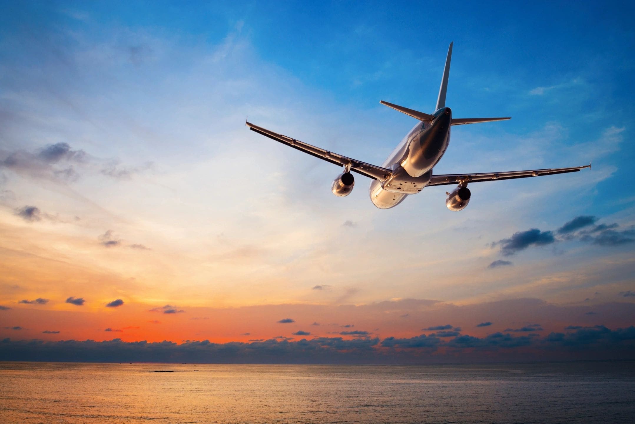 qtq80-SC9gXA plane flying into the sunset